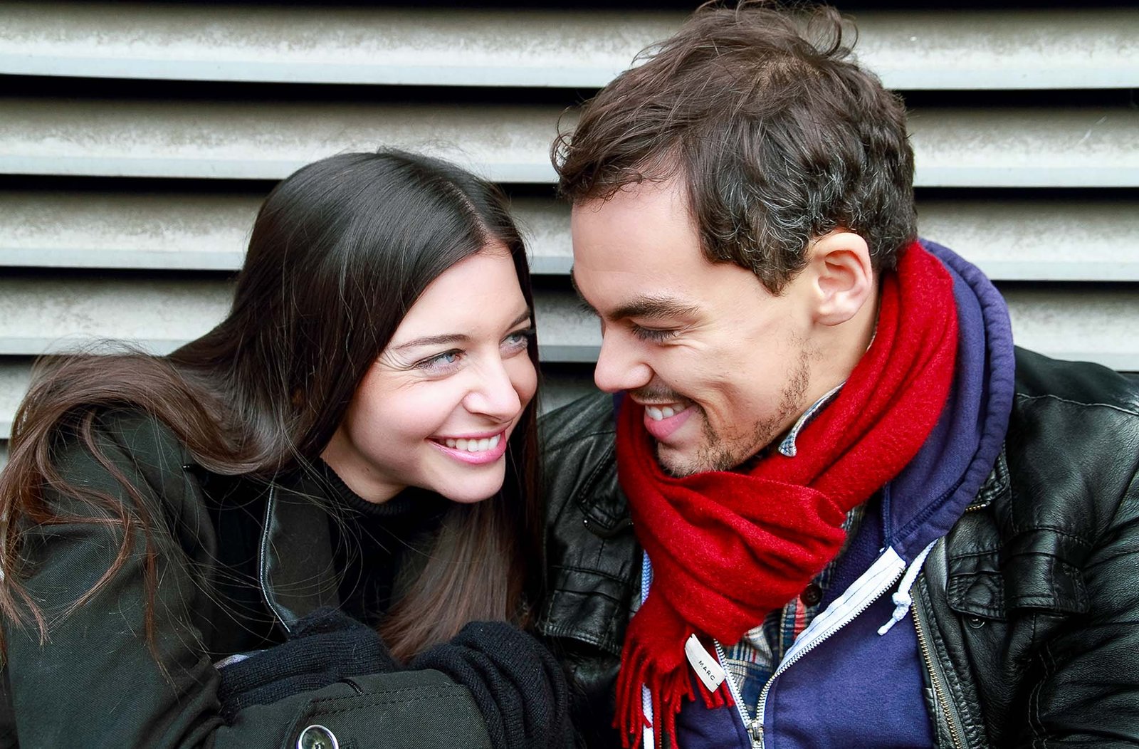 Lovely shot of a couple smiling and laughing intimately.