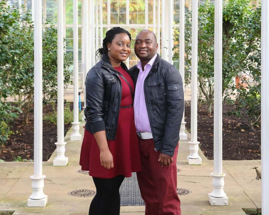 Anglo-African couple posing for their engagement photography session in Bristol